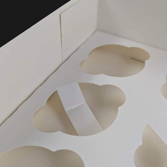 Our 12 cavity cupcake box with our E005B white cupcake cases Our 12 cavity cupcake box with our E005B white cupcake cases
